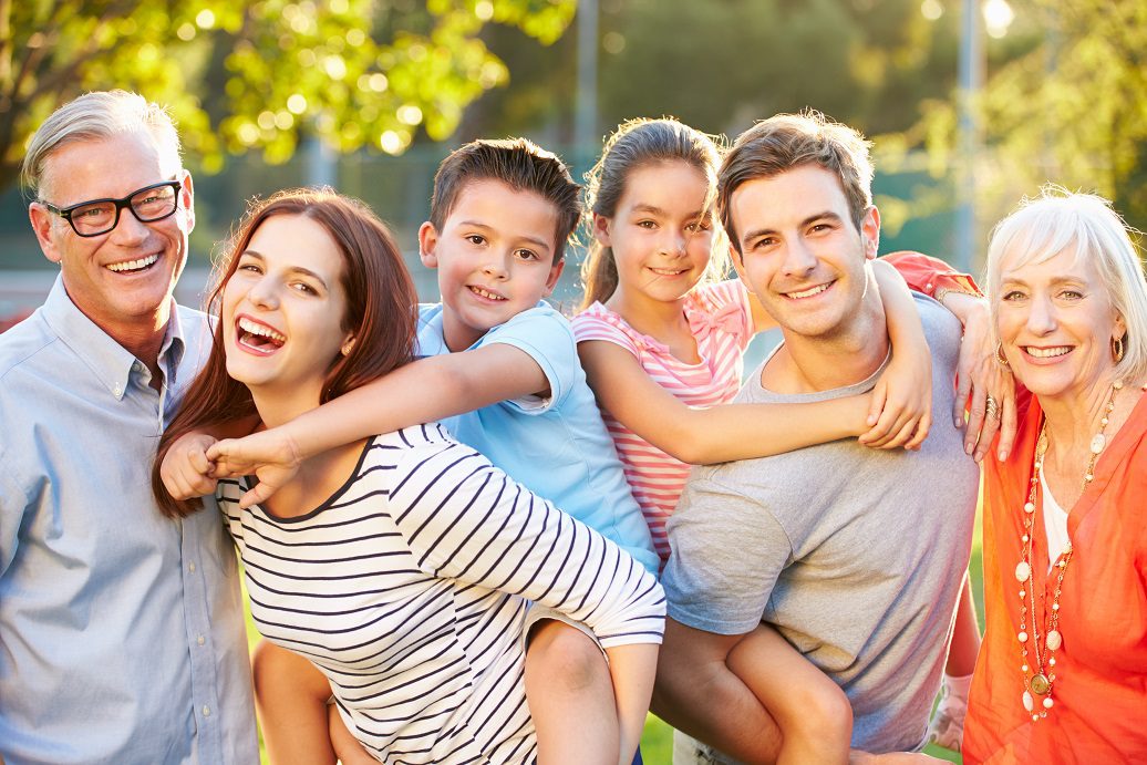 A family of four posing for the camera.